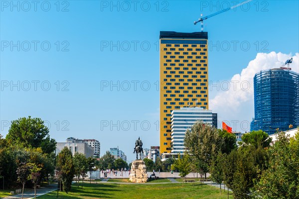 The beautiful Skanderbeg horse monument in Skanderbeg Square in Tirana seen from behind and the green park. Albania