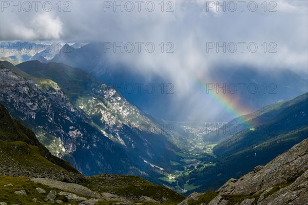 View from the Magdeburger Huette over the Pflerschtal valley with rainbow