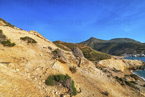 Unique natural rock formations of yellow and orange cliffs in low sunlight