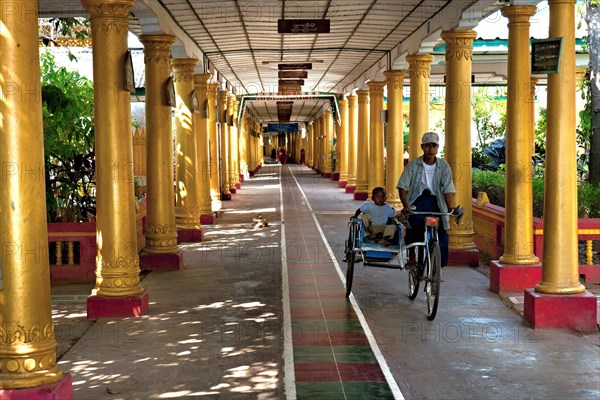 Rickshaw in monastery school with golden pillars