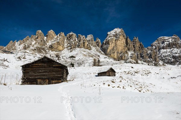 Snow-covered mountains and alpine hut