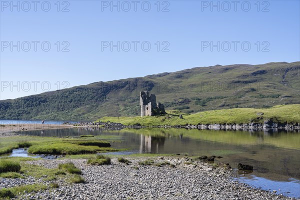 The ruins of Ardvreck Castle on a peninsula in the freshwater loch of Loch Assynt