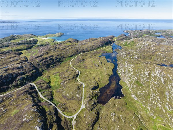 Aerial view of the sparsely populated Northwest Highlands with the single track road and pass road B869