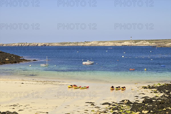 Small bay with canoes on the island of Ouessant