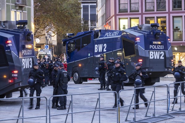 Water cannon and police in the city centre