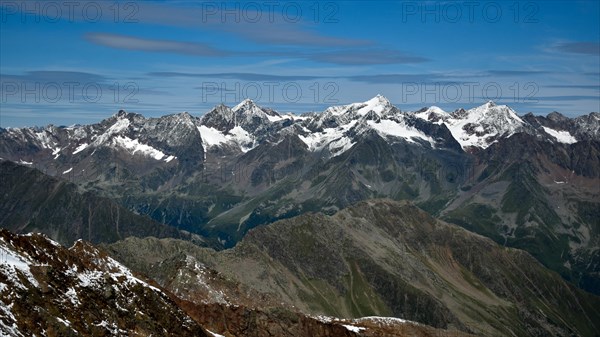 The ridge of the Ruderhofspitze in the Stubai Alps with fresh snow in summer