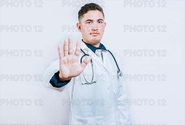 Young doctor counting number 5 on isolated background. Doctor counting number five isolated