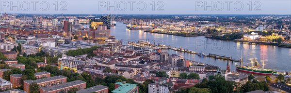 Panorama aerial view of the port of Hamburg at blue hour with Landungsbruecken