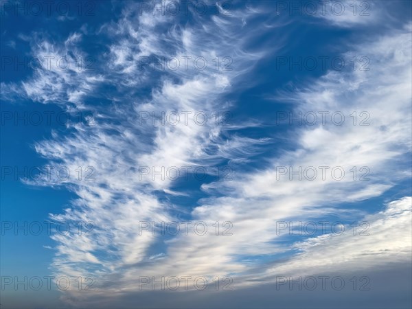 Blue sky with clouds Feather clouds Veil clouds Cirrostratus run diagonally through the image