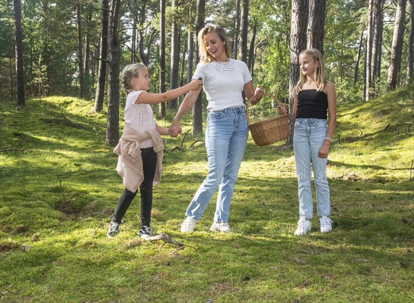 Blonde woman with two girls