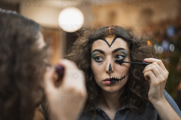 Hair and makeup preparations for the Halloween party