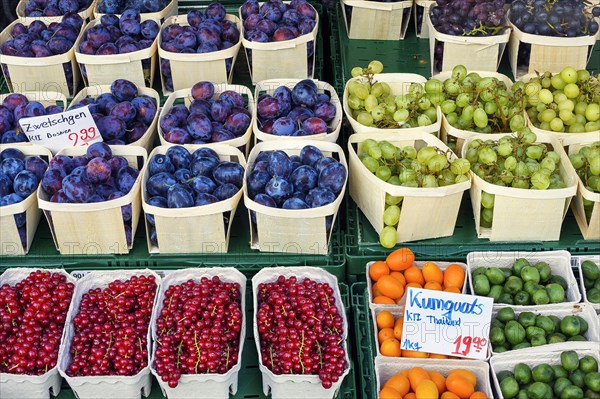 Market stall with plums