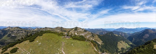 Drone image of the summit cross on the Pitscherberg with a view of the Osterhorn