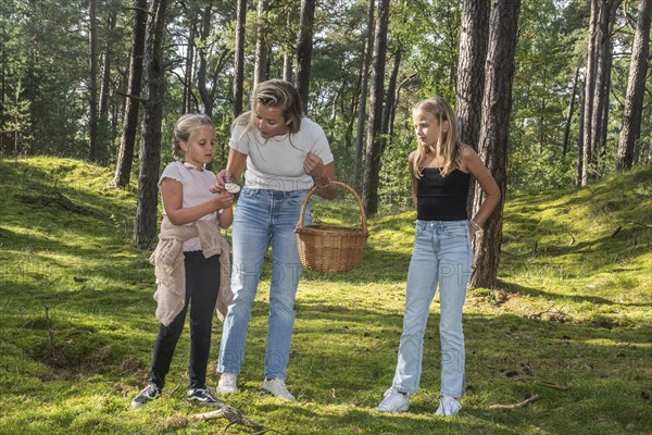 Blonde woman with two girls