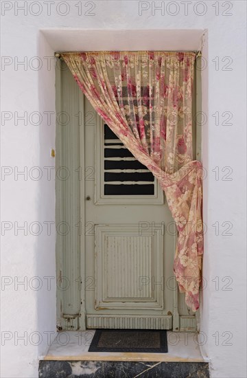 Frontal shot of authentic doorway of traditional Greek house