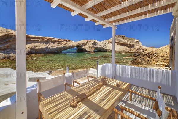 Summer villa by seafront on sunny day. Small private bay