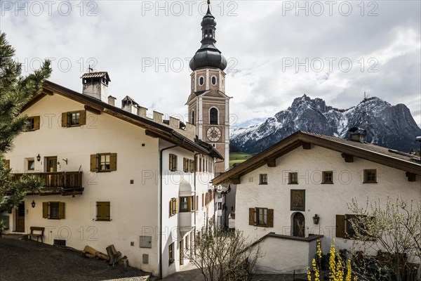 Village and snow-capped mountains