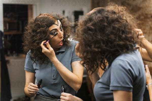 Hair and makeup preparations for the Halloween party