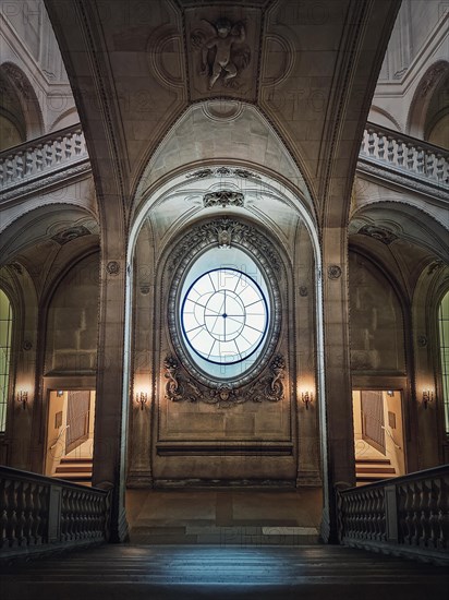 Louvre Palace symmetric architectural details of a hall with stone staircase