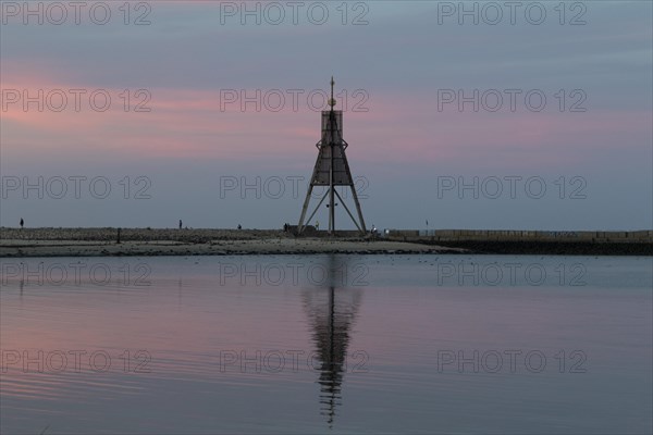 Kugelbake with water reflection in the sunset