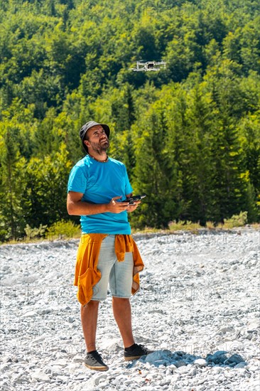 Drone pilot man exploring new places in the mountain in the Valbona natural park. Albania