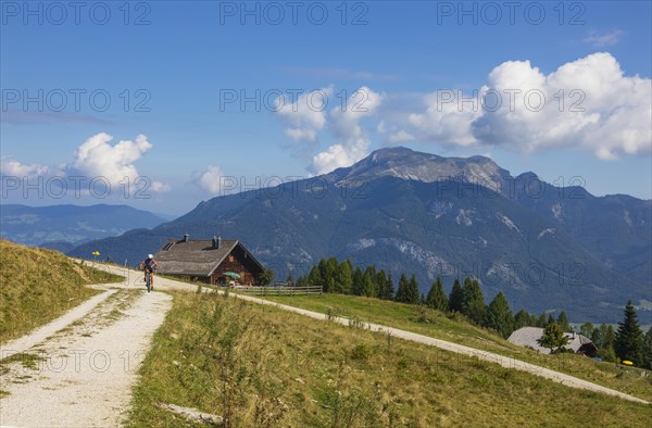 Alpine landscape with mountain bikers