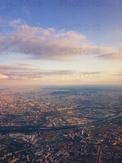 Aerial cityscape view from a plane over St Denis district and Seine river in Paris
