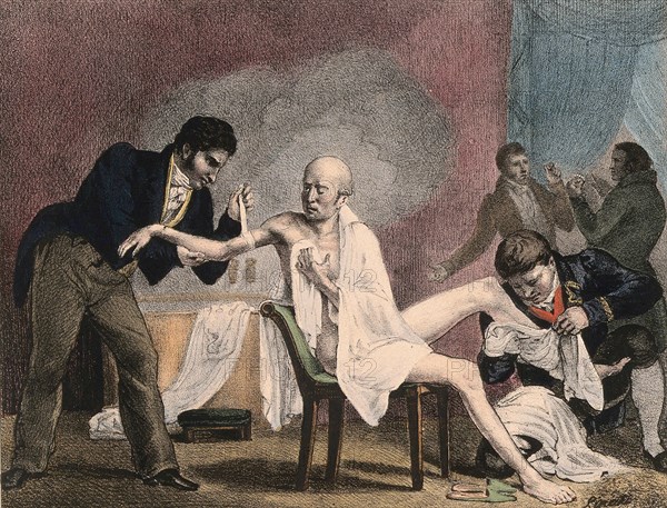 An emaciated old man being treated by four doctors