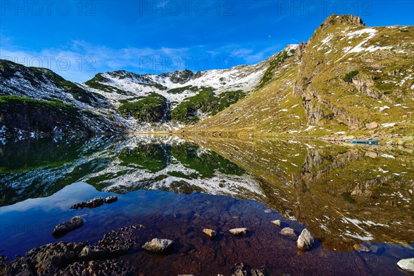 Reflection in the Wildsee lake at Wildseeloder in autumn early morning