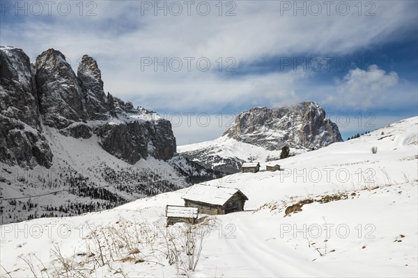 Snow-covered mountains and alpine hut