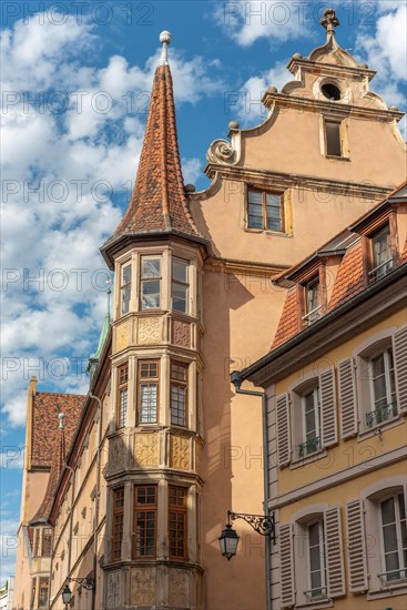 Turret of an old building in a city centre. Colmar