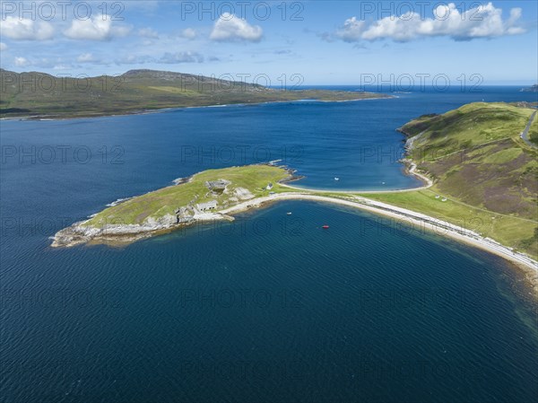 Aerial view of the Ard Neaki peninsula in the sea loch of Loch Eribol with the abandoned lime kilns and ferry house