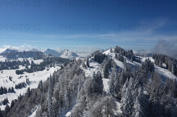 Winter landscape covered in deep snow on the Zwoelferhorn with a view of the Pillstein