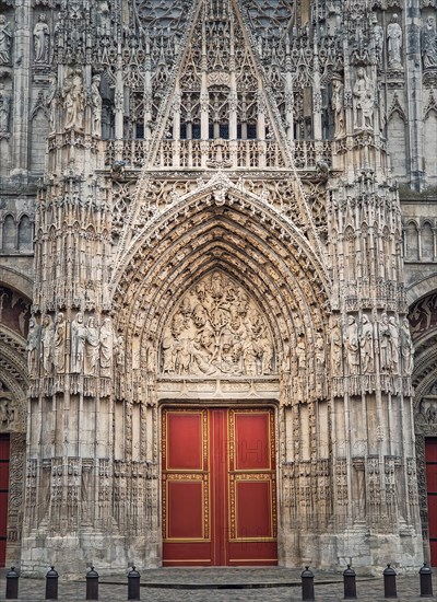 Notre Dame de Rouen Cathedral entrance door. Architectural landmark facade details featuring styles from Early Gothic to late Flamboyant and Renaissance architecture