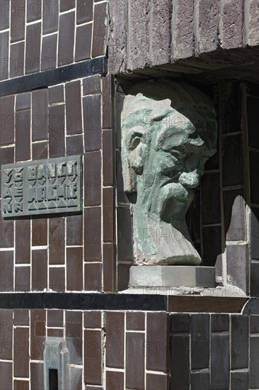 Tiled facade with bust of a man