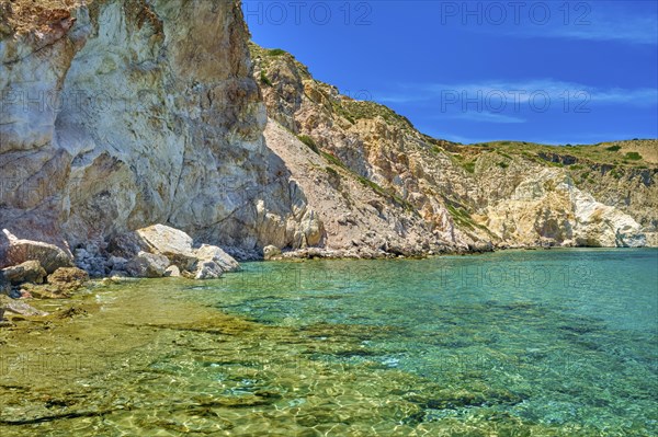 Beautiful view of high hill slope of island in Mediterranean Sea. Blue sea waters