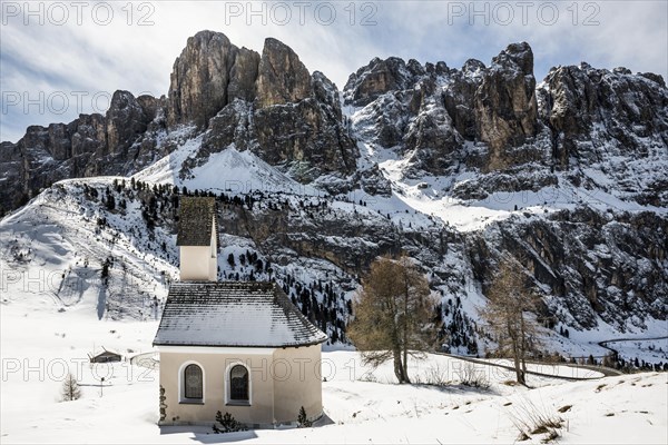 Snow-covered mountains and chapel