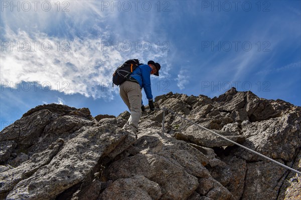 Climbers on the via ferrata on the Schneespitze in the Stubai Alps