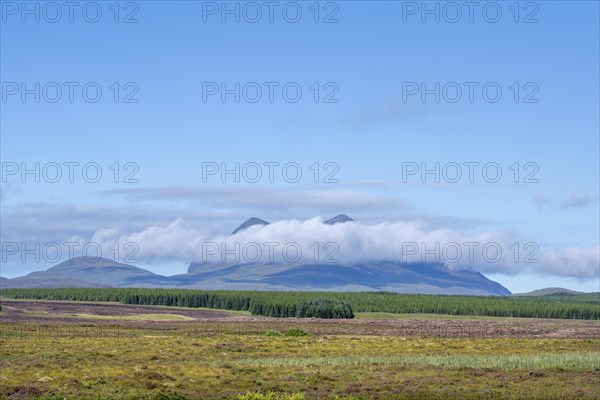 A band of clouds passes by the 849 m high mountain Cul Mor