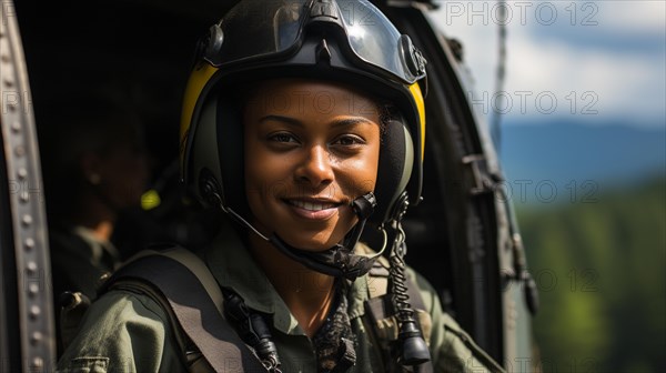 Female african american military helicopter pilot standing near her aircraft