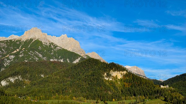 Lichtenberg Castle near Saalfelden in autumn with Persailhorn and Breithorn