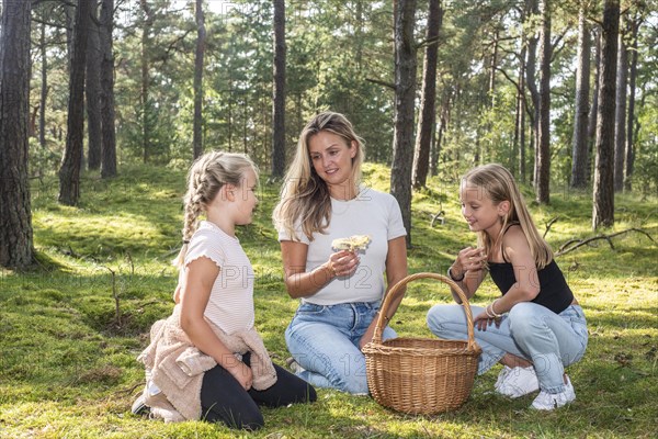 Blonde woman with two girls