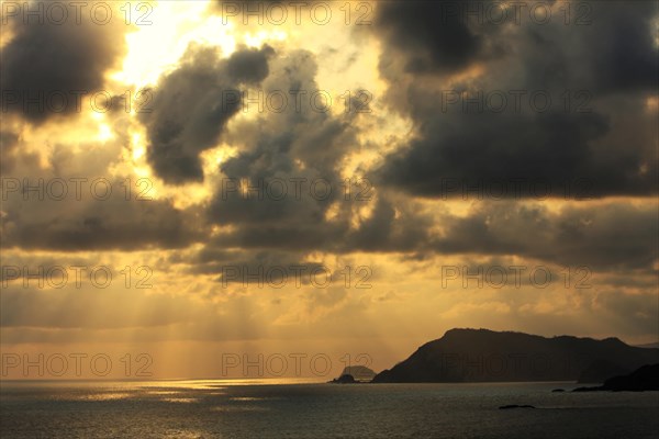 Tropical cloudy sky at sunset