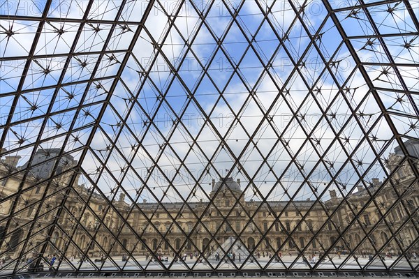 View from inside the pyramid to the buildings of the Louvre