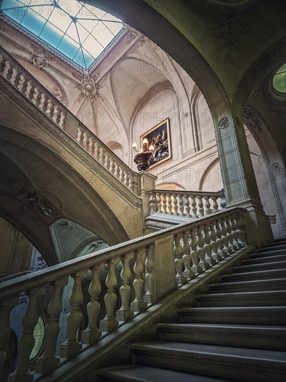 Louvre Palace architectural details of a hall with stone staircase