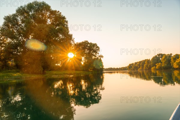 Sunset from a boat on a tourist excursion on Lake Shkoder in Shiroka. Albania