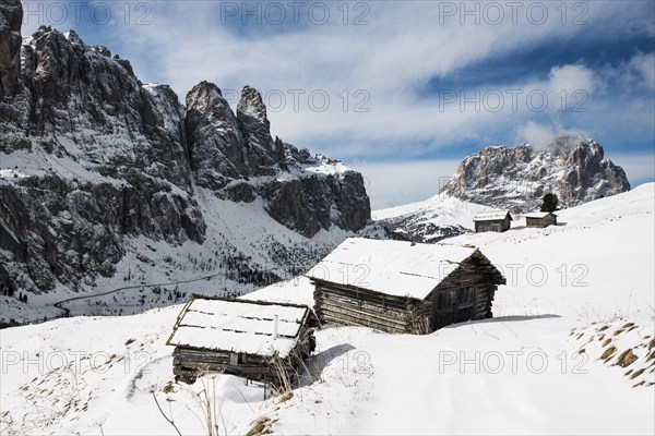 Snow-covered mountains and alpine hut