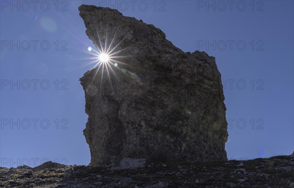 Rock Tower in the Alps with Sun Star in the Alps