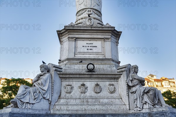 Figures at the base of the statue of Pedro IV