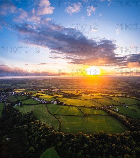 Panorama of Sunset over Fields and Farms from a drone